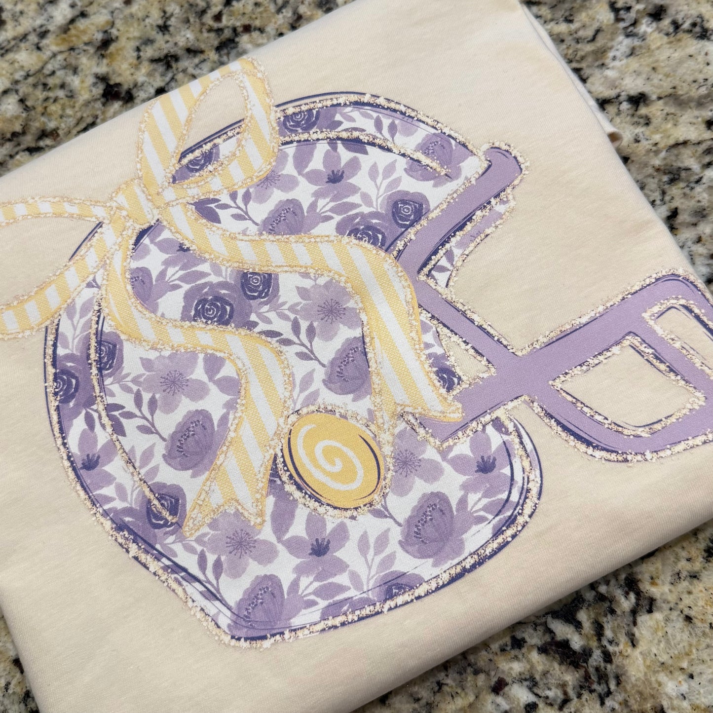 PURPLE FLORAL FOOTBALL HELMET TEE