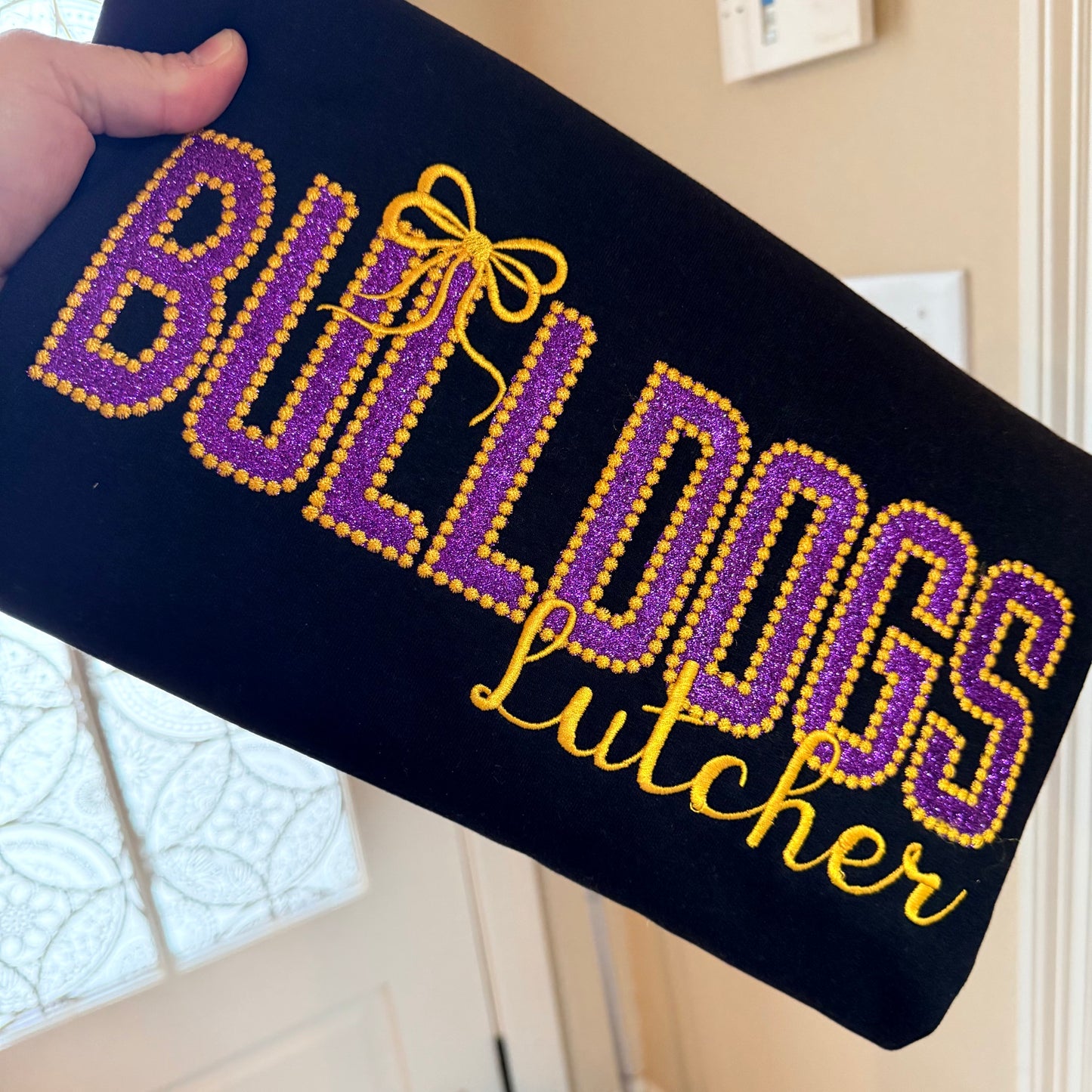 PURPLE GLITTER APPLIQUE BULLDOGS ON BLACK