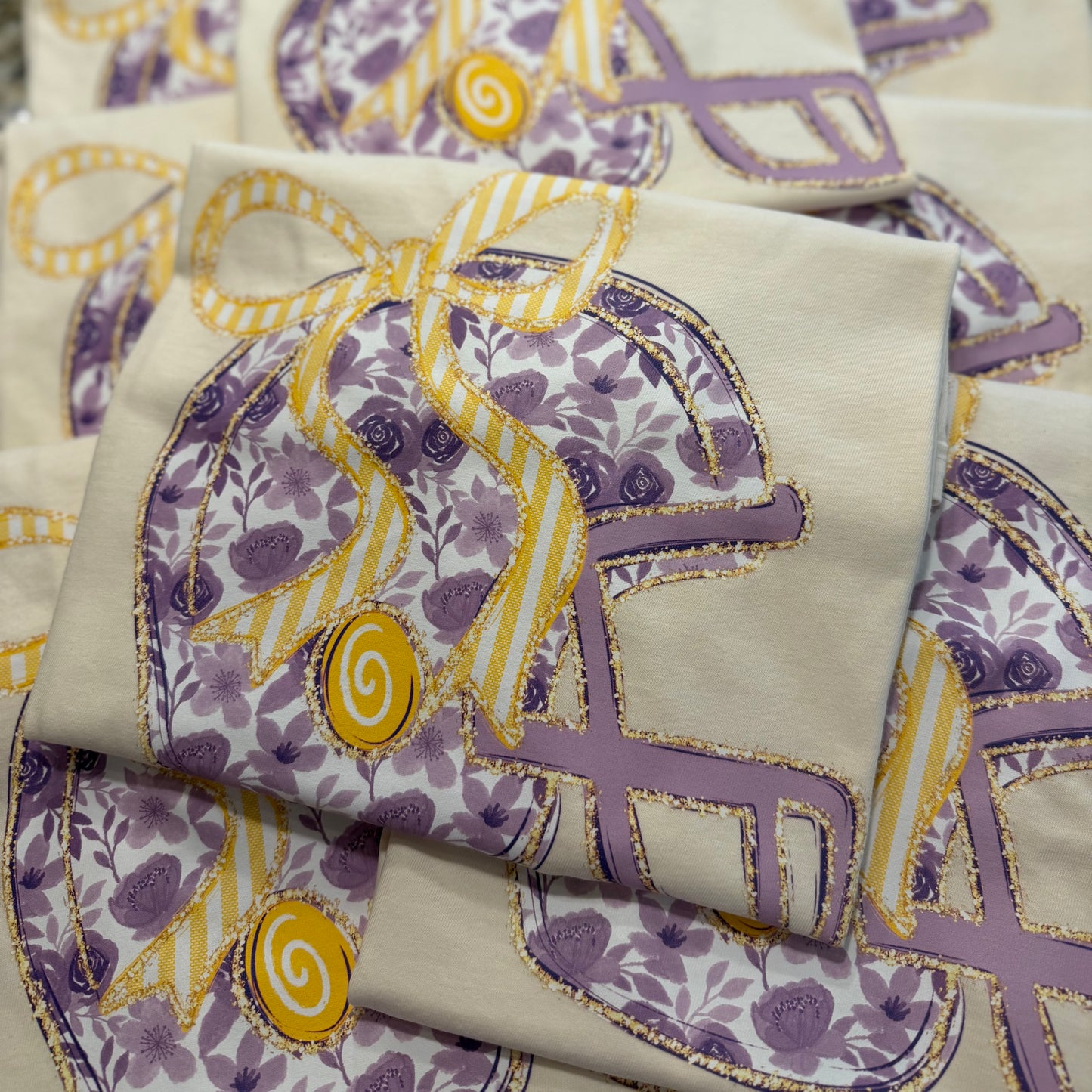 PURPLE FLORAL FOOTBALL HELMET TEE