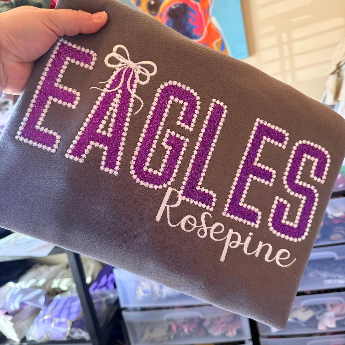 PURPLE GLITTER APPLIQUE EAGLES ON CHARCOAL GREY
