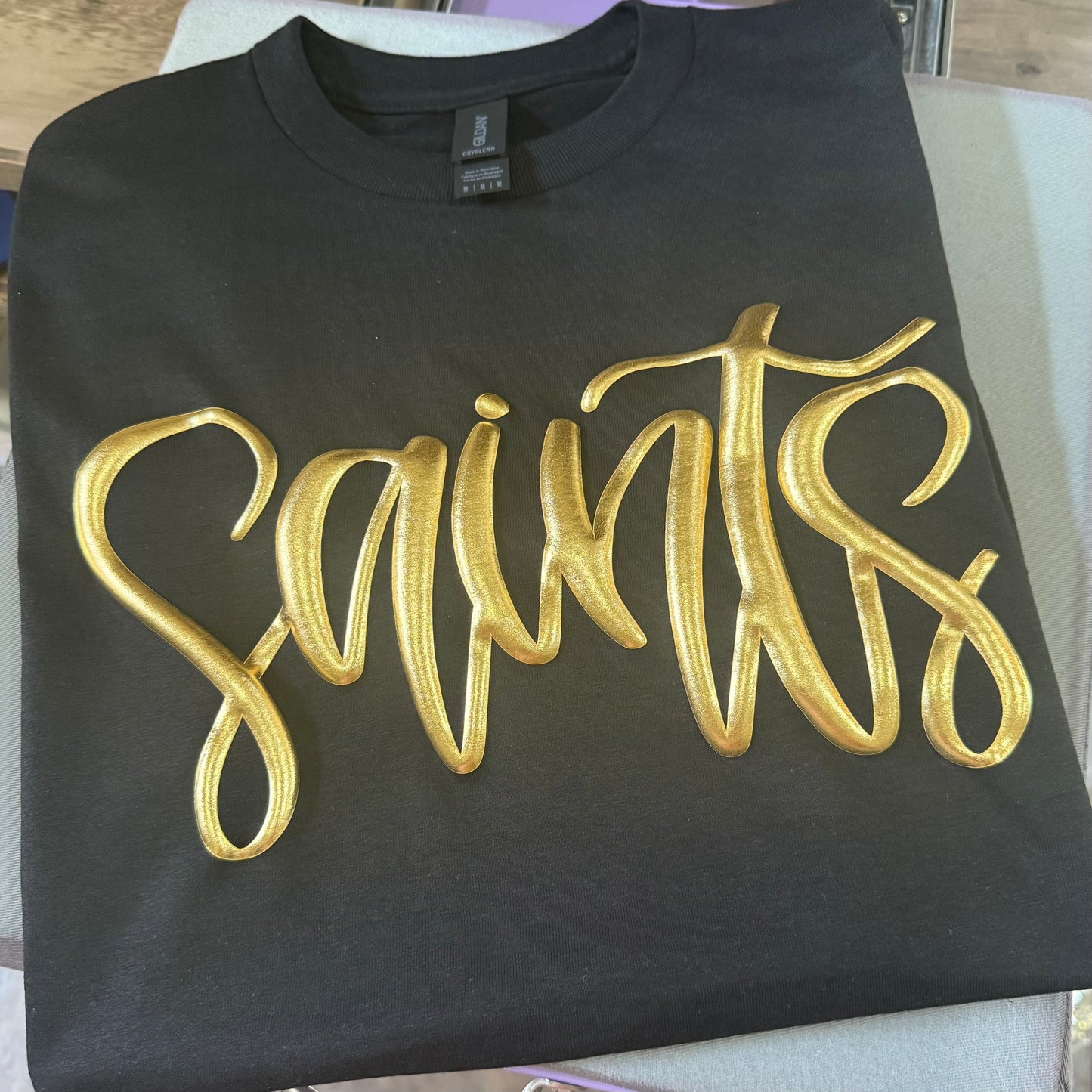 METALLIC GOLD PUFF SAINTS TEE & SWEATSHIRT